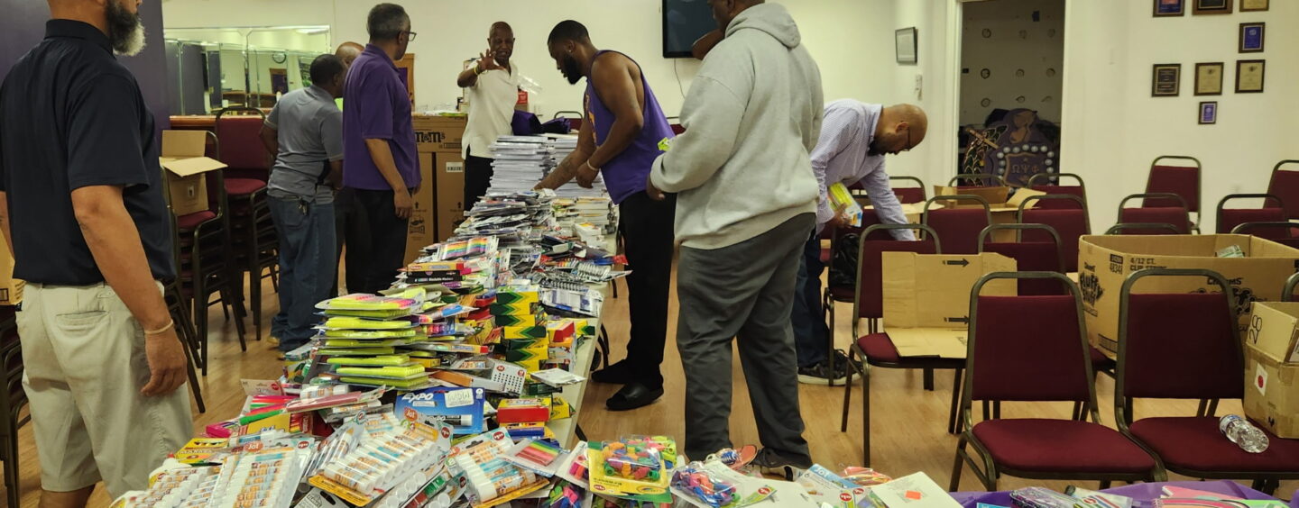 Omegas Provide School Supplies, Haircuts for Local Students